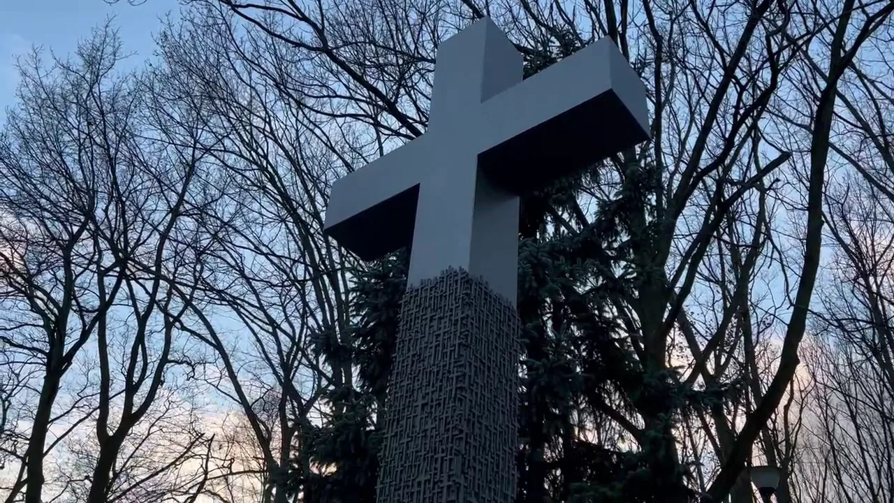 Original photograph of A cross among the memorials at Warsaw Insurgents Cemetery