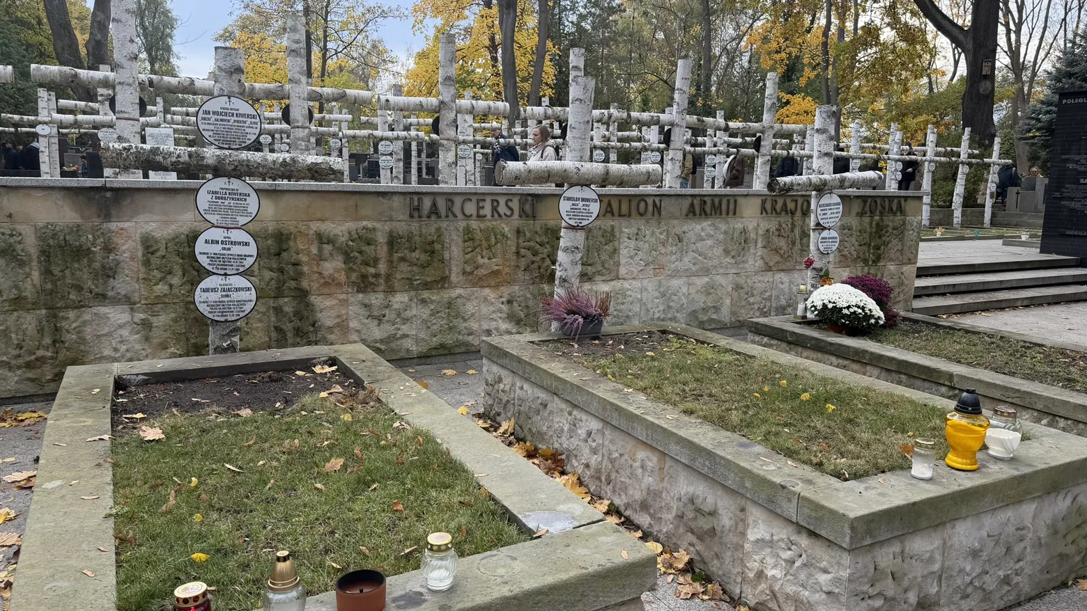 The Zośka battalion plot, with its name inscribed along the stone wall.