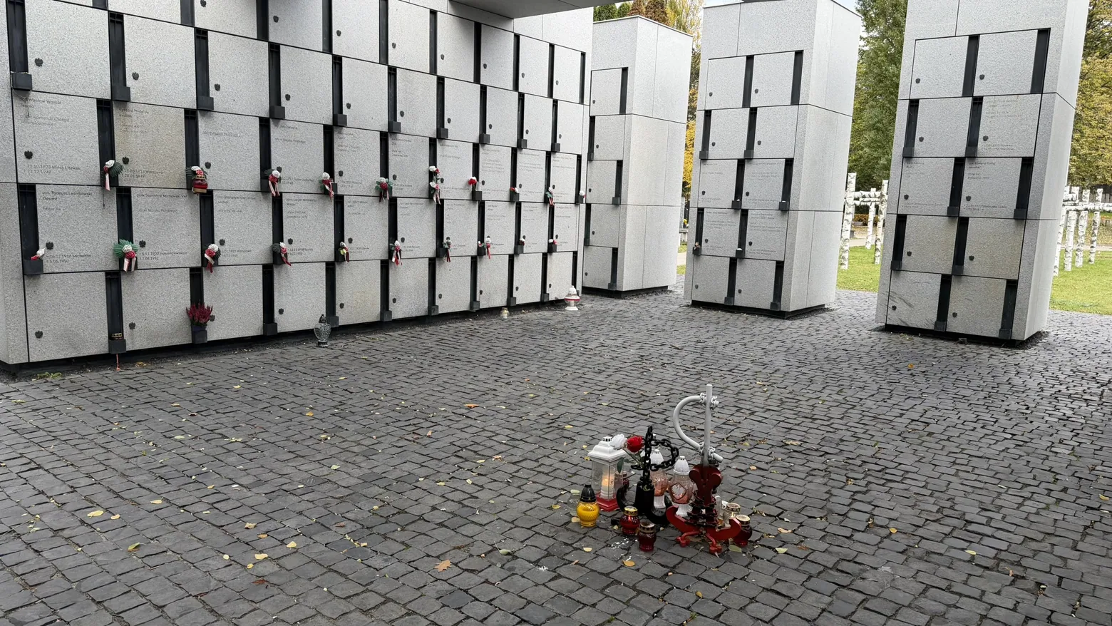 Names and candles within the Łączka Panteon–Mauzoleum.