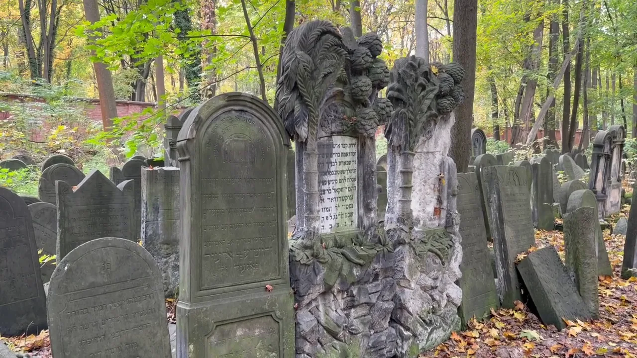 Ornately carved historic Jewish headstones in the cemetery on Okopowa Street