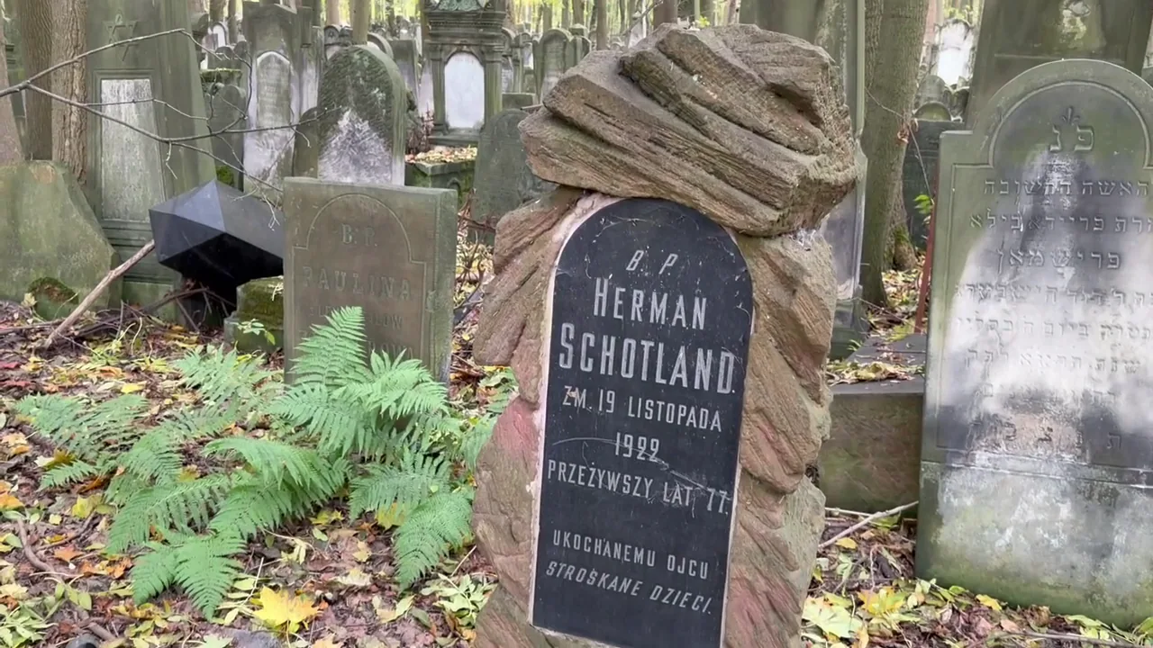 Historic stone graves and Hebrew lettering in the cemetery on Okopowa Street