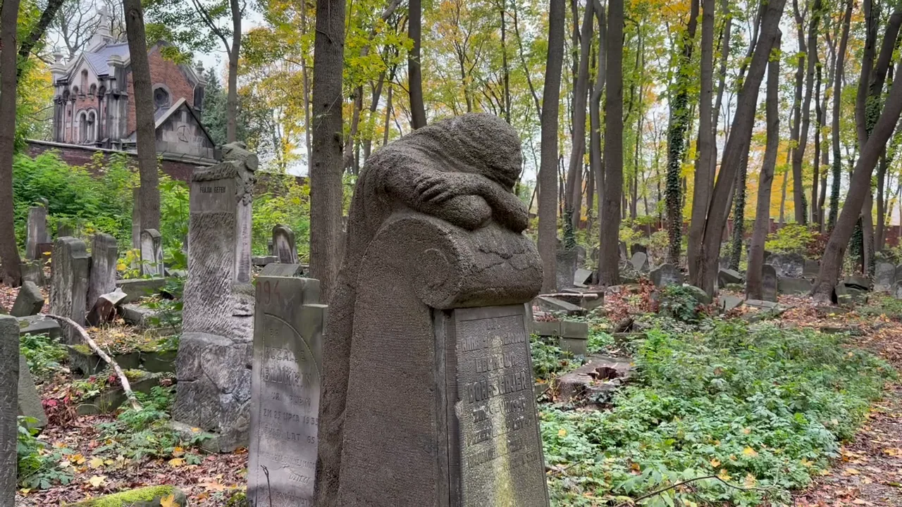 A dense group of historical gravestones at Okopowa Cemetery